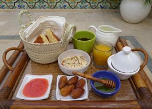 a tray of food with bread and other foods on it at Dar Mayya in Tunis