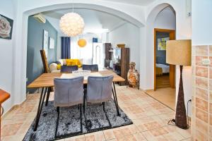 a dining room with a table and chairs at Apartman Tino with two sunny terace in Hvar +35 photos