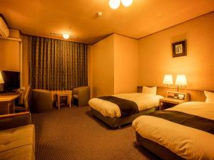 Ooedo Onsen Monogatari Unazuki Grand Hotel客房内的一张或多张床位