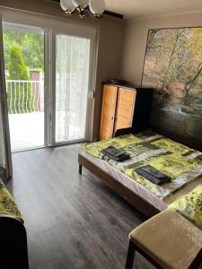 Posteľ alebo postele v izbe v ubytovaní Z&T Apartmanok