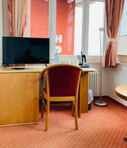 TV a/nebo společenská místnost v ubytování Hotel Germania