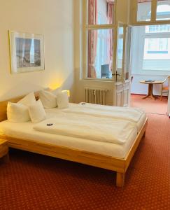 Postel nebo postele na pokoji v ubytování Hotel Germania