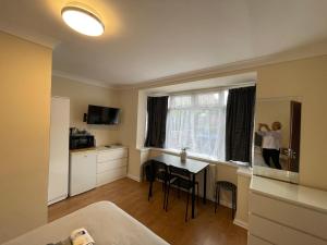 a person is taking a picture of a room at Kensal Lodge 2 Guest House in London