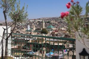 a view of a city from the top of a building at Riad Batchisarai in Fez
