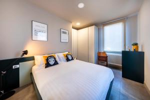 מיטה או מיטות בחדר ב-Stadler Loft