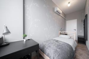 Postel nebo postele na pokoji v ubytování Lollo Motel Graičiūno - Lollo Luxury