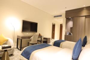 TV o dispositivi per l'intrattenimento presso فندق سافوي جدة Savoye Hotel