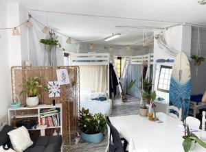 a room with a bed and a table with plants at Casanaga in Almáciga