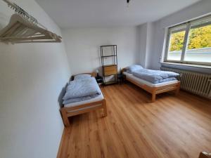 Кровать или кровати в номере Monteurzimmer