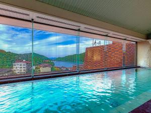 Bazén v ubytování Ooedo Onsen Monogatari Unzen Toyokan nebo v jeho okolí