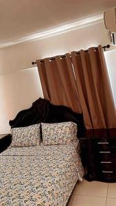 Ein Bett oder Betten in einem Zimmer der Unterkunft Apartamento en torres del Farallón, SDE, RD