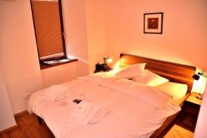 Voodi või voodid majutusasutuse Unique Hotel Fusio toas