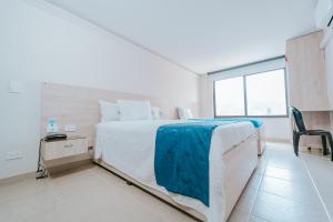 Postel nebo postele na pokoji v ubytování HOTEL VERANO