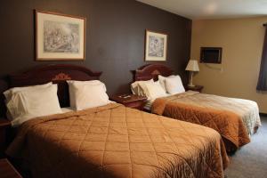 En eller flere senge i et værelse på Gold Country Inn