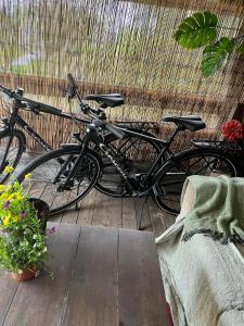 a couple of bikes parked next to a fence at 15 min från Ullared! Ny stuga med hög standard! in Älvsered