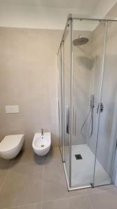 a bathroom with a shower and a toilet and a sink at Appartamento Centro storico - Massa in Massa