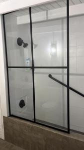 a glass display case with a toilet inside of it at Private Rooms in Duplex Home 4 Bath FQ Beds 1-3ppl in San Juan