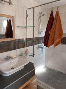 a bathroom with a sink and a shower at Le Tamier - Amazing holidays in Flic-en-Flac