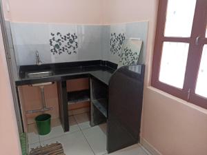 Η κουζίνα ή μικρή κουζίνα στο Naik home stay +26 φωτογραφίες