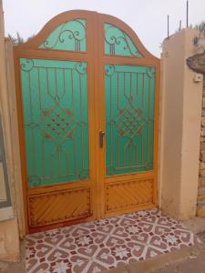 a gate in the entry to a house at شاليه ندى in Buraydah