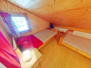 a small room with two beds in a cabin at Appartement Les Saisies, 1 pièce, 4 personnes - FR-1-594-150 in Hauteluce