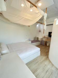 Letto o letti in una camera di White&Light B&B
