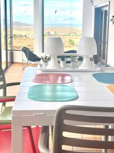a white table with two lamps on top of it at Casa Estela in Villaverde