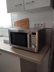 a microwave sitting on top of a table at Studio en Petite Camargue in Le Cailar
