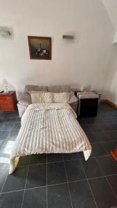 a bed and a couch in a room at 55A Castlewellan Main Street in Castlewellan