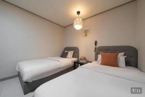 Postel nebo postele na pokoji v ubytování Ggumgguda Hotel + 21 fotografií