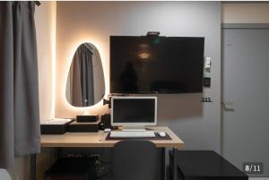 TV a/nebo společenská místnost v ubytování Ggumgguda Hotel
