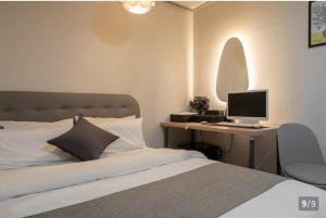 Postel nebo postele na pokoji v ubytování Ggumgguda Hotel