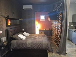 a bedroom with a bed with towels on it at Le nid douillet in Chaumuzy