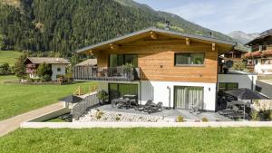 an aerial view of a house with a patio at Bergmadl Apartments in Neustift im Stubaital