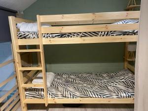 a bunk bed room with two bunk beds at Domaine du Bonsoy--Azur in Blaimont