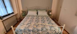 a bed in a small room with a bed frame at Cascina Della Rocca in Caselle Torinese
