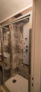 a bathroom with a shower and a sink at Cascina Della Rocca in Caselle Torinese