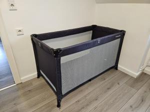 a large black bed in the corner of a room at Ferienwohnung zur Grenze in Gronau