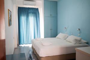 A bed or beds in a room at Kamelia