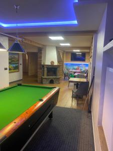 a billiard room with a pool table in it at Szarotka Wynajem Pokoi in Zakopane