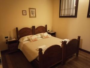 Postel nebo postele na pokoji v ubytování Agriturismo Il Salice Ridente