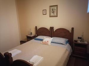 Postel nebo postele na pokoji v ubytování Agriturismo Il Salice Ridente