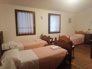 Postel nebo postele na pokoji v ubytování Agriturismo Il Salice Ridente