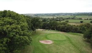 an overhead view of a green golf course at Shylo - Down At The Dales in Barry