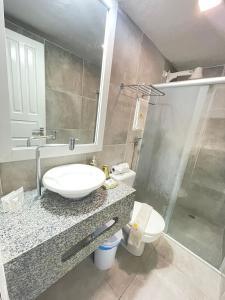 Kylpyhuone majoituspaikassa Pousada Angra do Porto