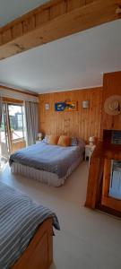 Ένα ή περισσότερα κρεβάτια σε δωμάτιο στο Condominio Don Alberto