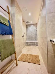 a bathroom with a walk in shower and a walk in shower at Beachfront Haus Meer in the heart of Arguineguin in Arguineguín +20 photos