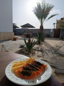 a plate of food on top of a table at Vilas na areia aparthotel in Sal Rei