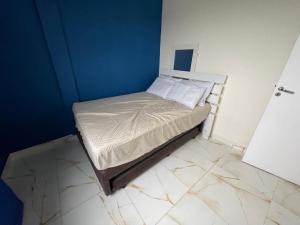 Postel nebo postele na pokoji v ubytování Apartamento 51 proximo a praia da Enseada + 12 fotografií