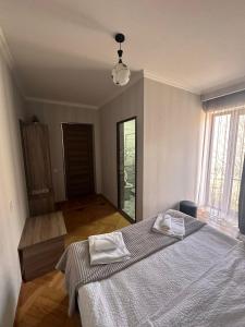 A bed or beds in a room at GIO-NIKA